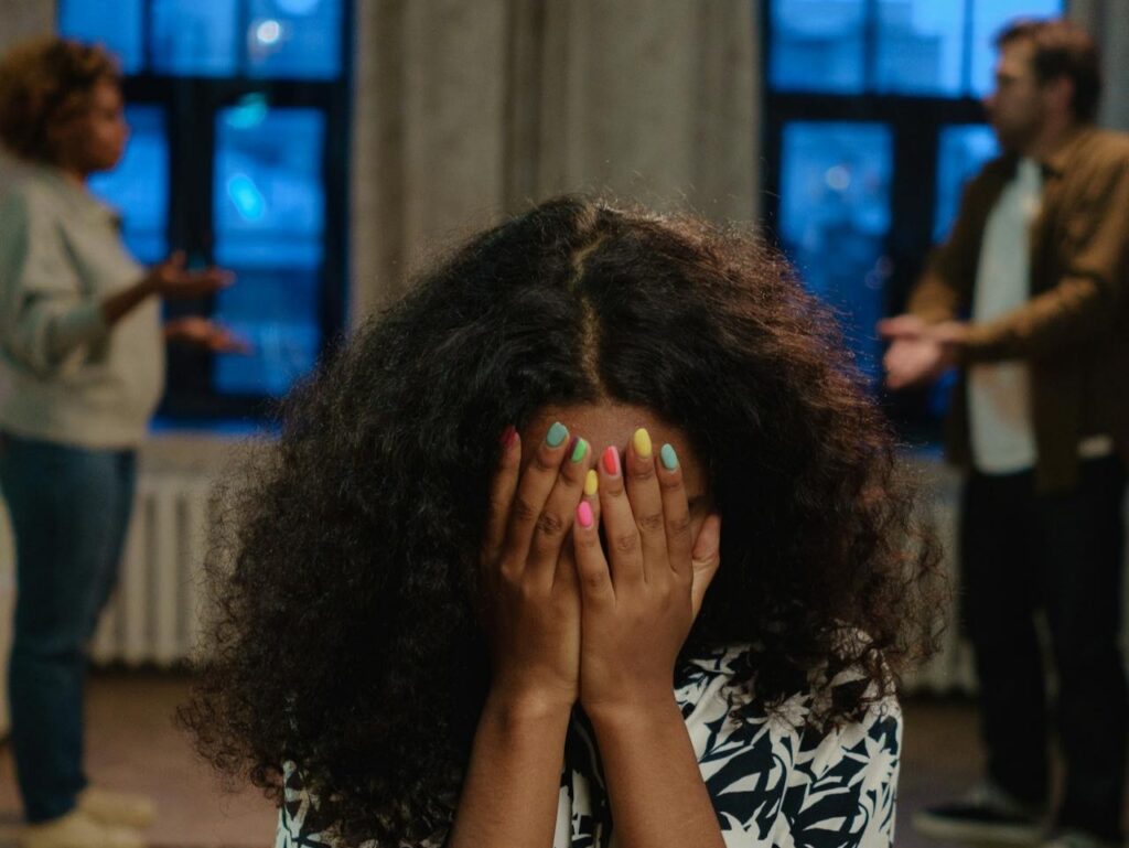 A-Girl-in-Black-and-White-Shirt-Covering-Her-Face