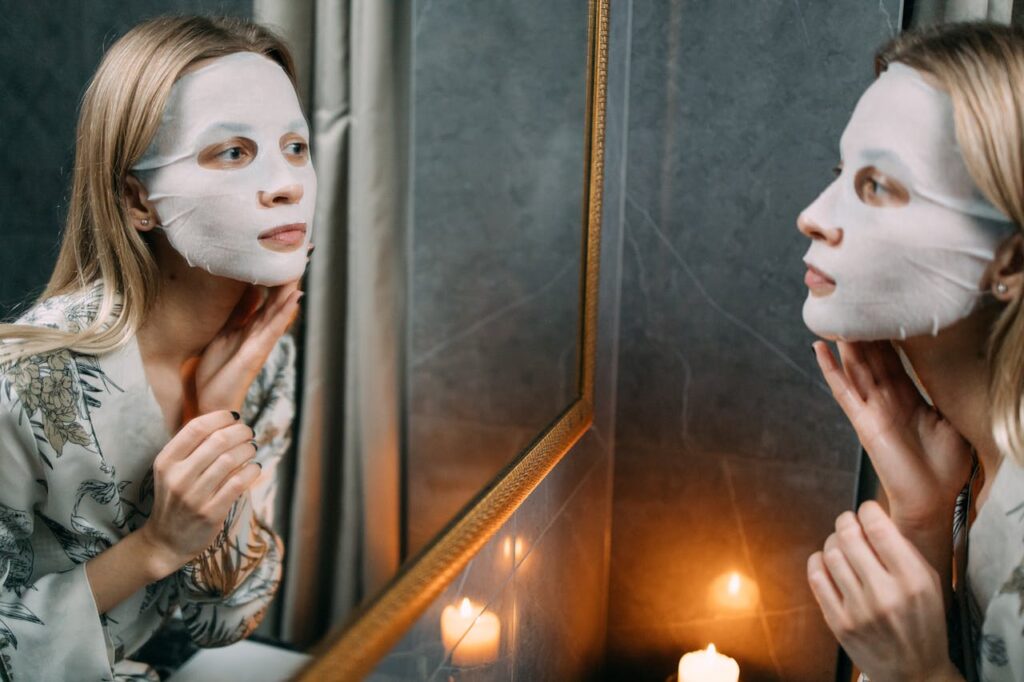 A-Woman-With-Sheet-Mask-Looking-at-the-Mirror