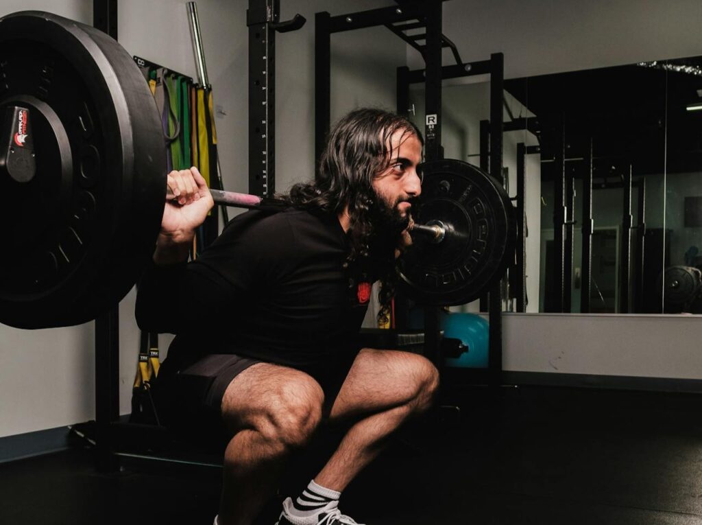 Bearded-Man-in-Black-Long-Sleeve-Shirt-Weightlifting