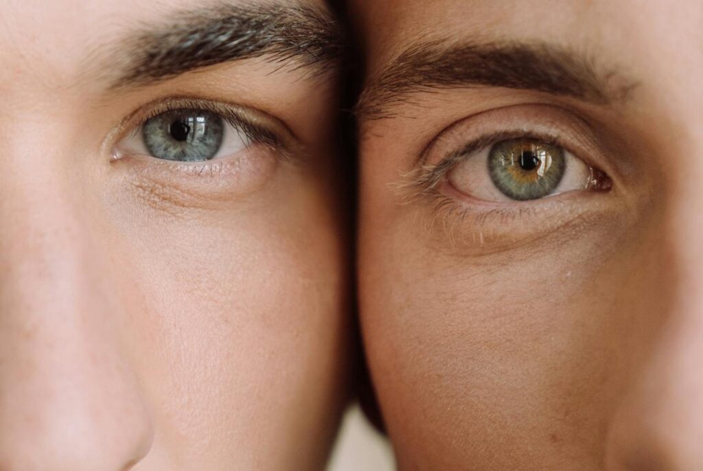 Close-up-View-Of-Two-Faces-Of-Men