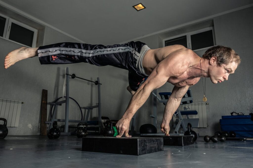 Man-Balancing-his-Body-with-his-Fingers