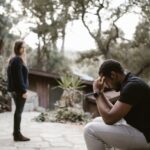 Man-Sitting-alone-on-a-Wooden-Bench-after-a-Breakup