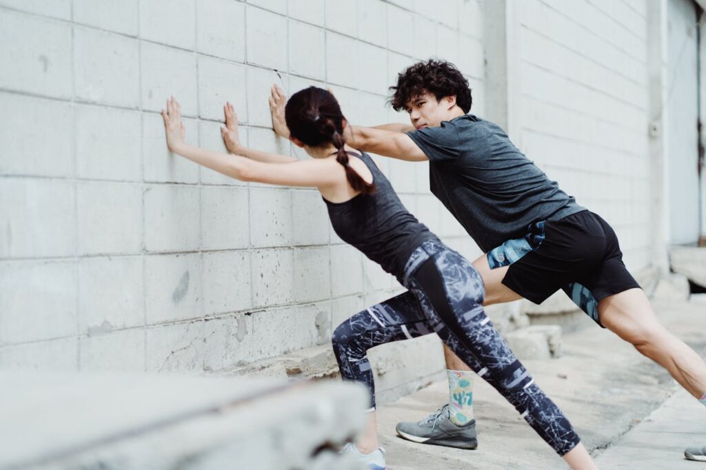 Man-and-Woman-Stretching-Together