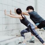 Man-and-Woman-Stretching-Together