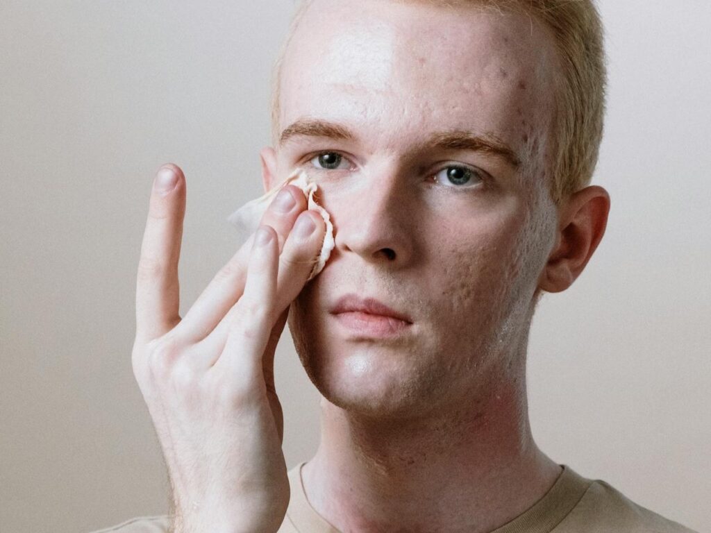 Man-in-Beige-Crew-Neck-Shirt-Covering-His-Face