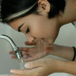 Woman-Washing-Her-Face-With-Water