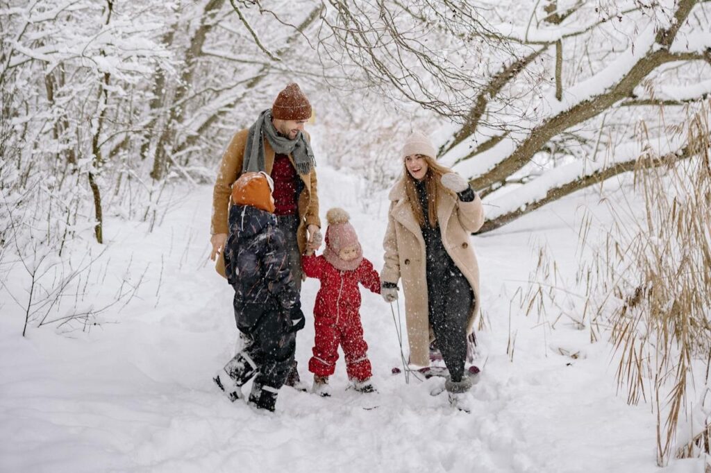 family-having-active-fun-in-the-snow
