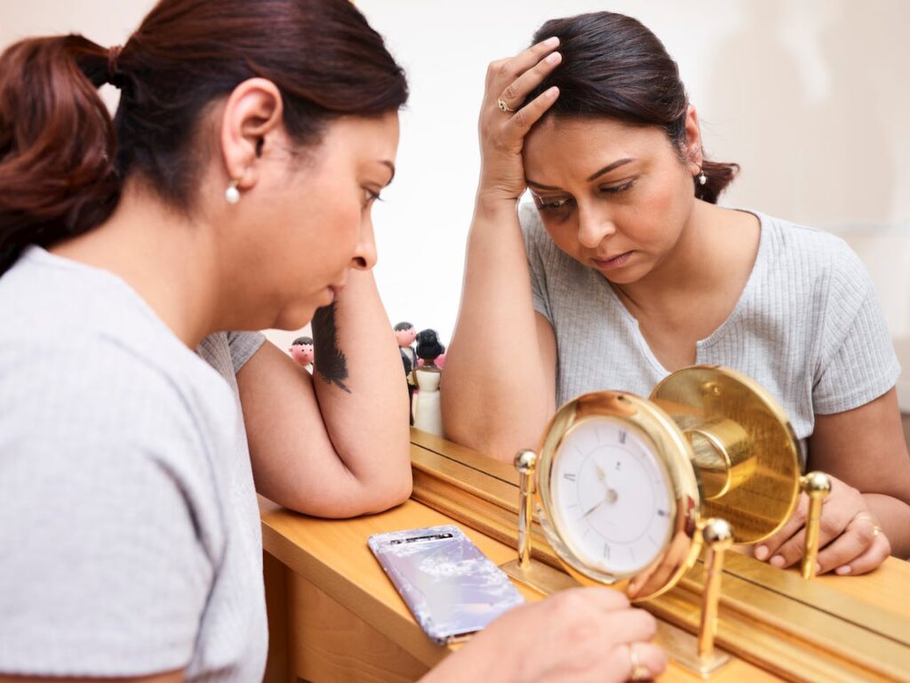 Tired-Woman-Sitting-by-Mirror