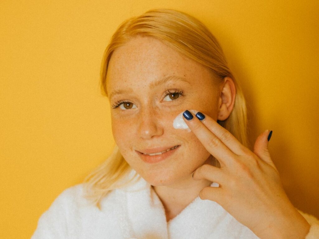 Woman-Applying-White-Cream-on-Her-Face
