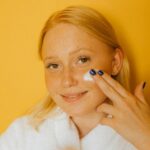 Woman-Applying-White-Cream-on-Her-Face