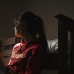 Woman-Sitting-On-Floor