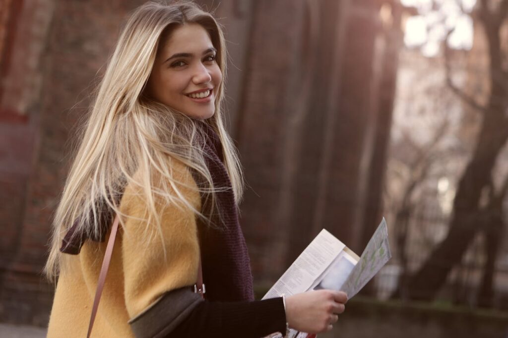 Woman-Smiling-While-Holding-Paper