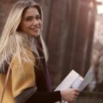 Woman-Smiling-While-Holding-Paper