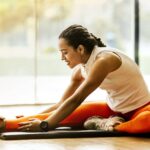 Woman-Stretching-on-Ground